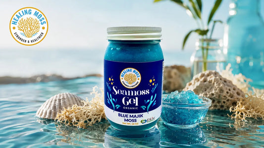 Healing Moss Blue Majik Sea Moss Gel jar on a reflective ocean-inspired surface with raw sea moss and a bowl of blue gel.
